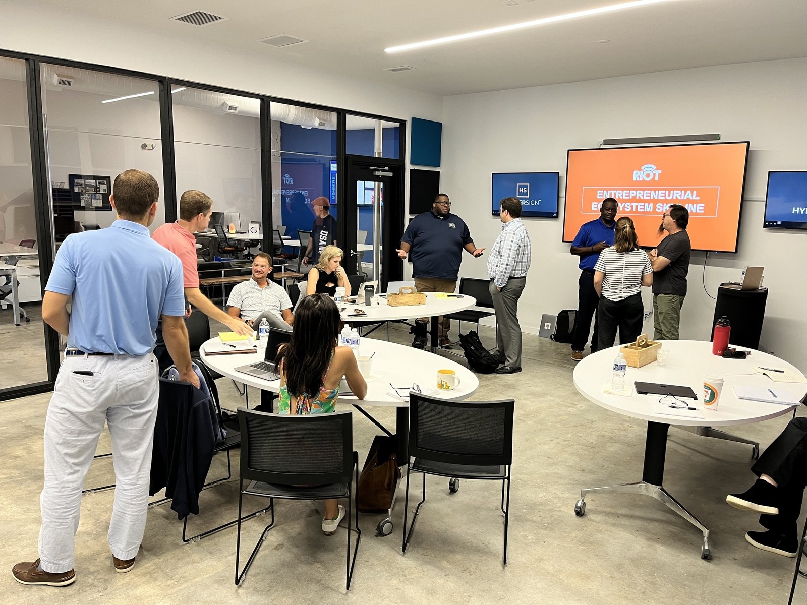 Founders and members meeting in the eMYRge coworking space at the HTC Aspire Hub in Myrtle Beach